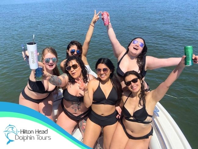 Bachelorette group celebrating with drinks on a private Hilton Head booze cruise with Hilton Head Dolphin Tours